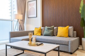 Living area - Luxe Apartments near Dubai Mall, Burj Khalifa - Pool, Gym, & Parking by Sojo Stay (Dubai)