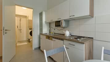 Microwave, dishwasher, coffee/tea maker, cookware/dishes/utensils