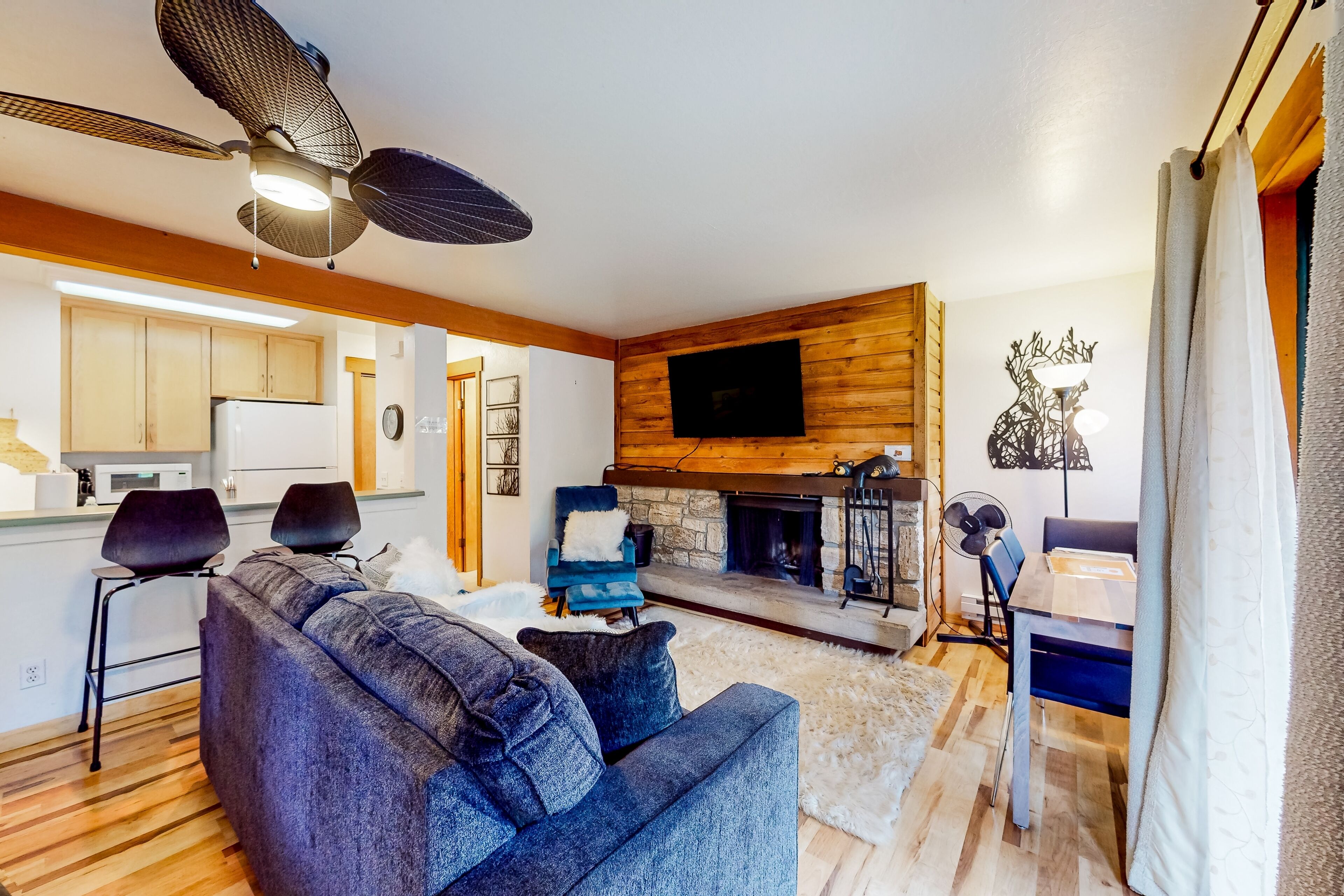 Ground-floor studio with fireplace, patio, full kitchen, on-site pool, & tennis