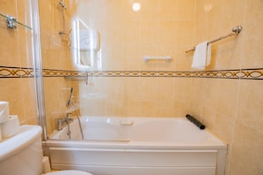 Bathtub, eco-friendly toiletries, hair dryer, towels