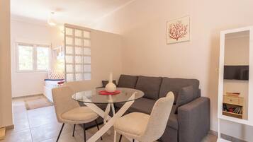 Family Triple Room, Multiple Beds, Kitchen, Sea View | Living area | 32-inch Smart TV with digital channels, Netflix, pay films