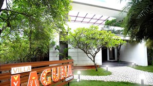 A sign with "VILLA LAGUNA" and a pathway leading to a building. - Truliv Villa LAGUNA (Tirupporur)