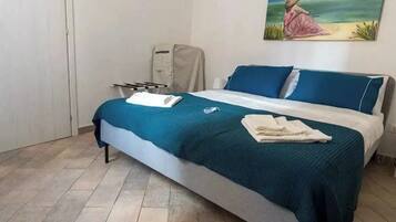 1 bedroom, desk, iron/ironing board, travel cot