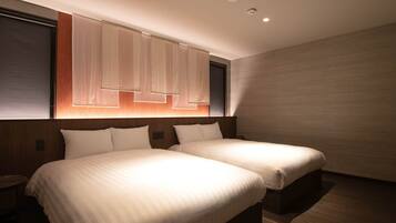 A modern hotel room with two beds, a wooden headboard, and a large window with blinds.