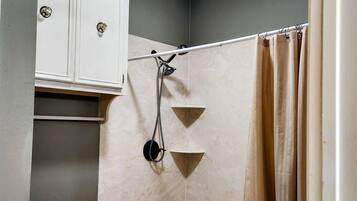 Shower, hair dryer, towels, toilet paper