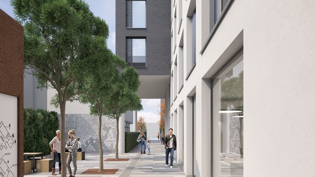 A modern building with a covered walkway, trees, and people walking. - Coleman Court Summer Accommodation (Cork)