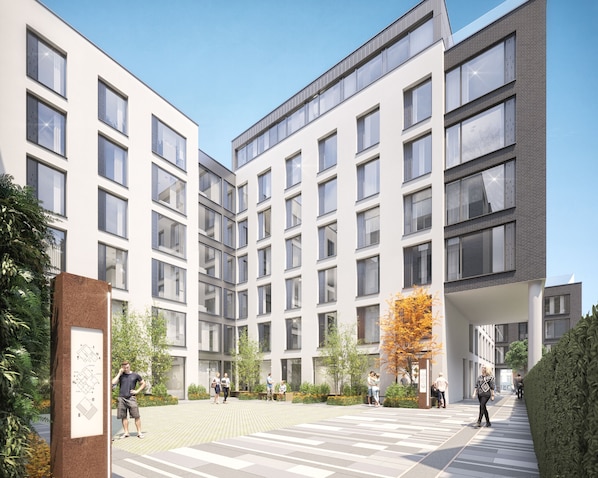 A modern building with multiple floors and large windows. - Coleman Court Summer Accommodation (Cork)