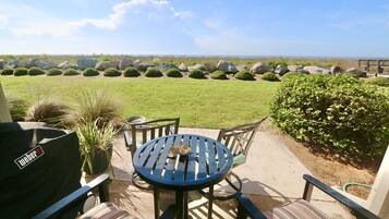 Enjoy al fresco dining on the patio with a barbecue grill and comfortable seating for four.