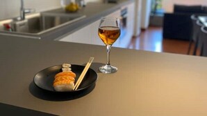 A modern kitchen with a dining area. - Athens Market Iconic Apartment, Amazing view of the Acropolis (Athens)