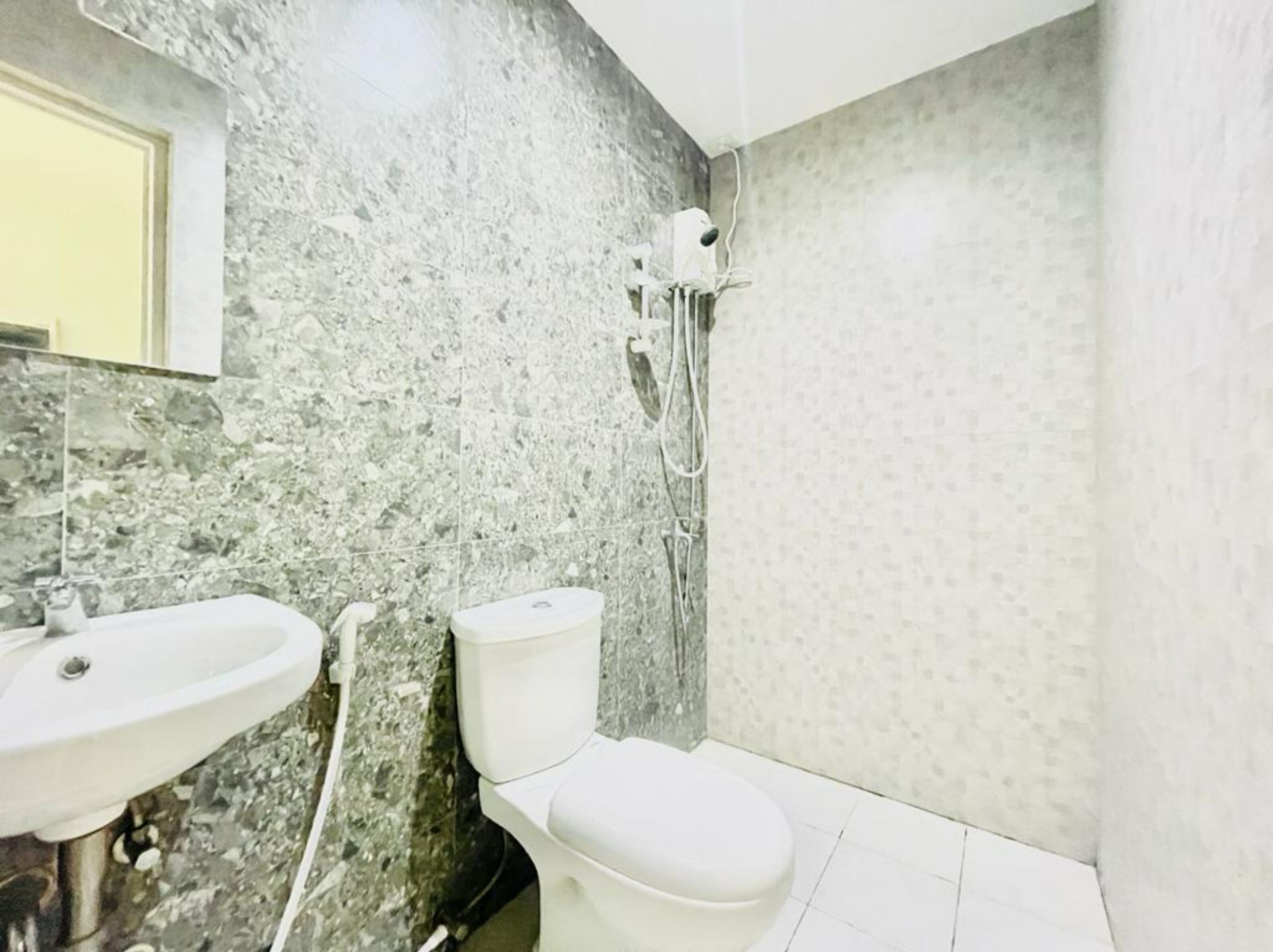 deluxe double room | bathroom | shower, towels, toilet paper