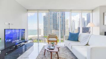 Luxury Condo, 2 Bedrooms, City View | Living area | 50-inch Smart TV with cable channels