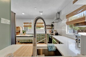 Fridge, microwave, oven, stovetop - 🔆Modern Coastal Beach Retreat: HEATED POOL, Newly Renovated, minutes to beaches (Clearwater)