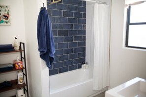 Shower, eco-friendly toiletries, hair dryer, towels