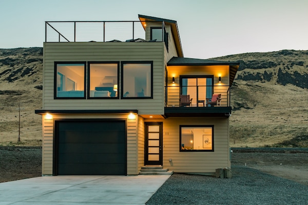 Warm and welcoming high desert modern style with views from every room.