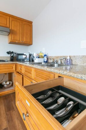 Fridge, microwave, stovetop, coffee/tea maker
