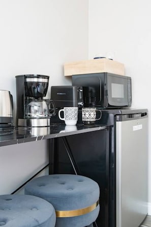 Enjoy a quick bite or a snack in our compact yet functional dining area, complete with a mini-fridge and microwave.