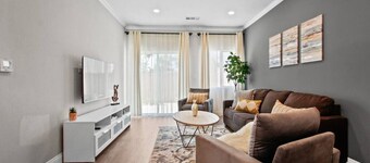 Cozy Urban Retreat: with King and Queen Beds, 1.5 Baths, Well-Equipped Kitchen, Private Backyard, and a Designated Parking Space.