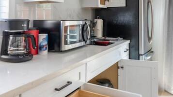 Fridge, microwave, stovetop, coffee/tea maker