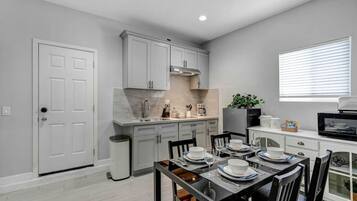 Fridge, microwave, stovetop, coffee/tea maker