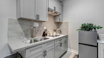 Fridge, microwave, stovetop, coffee/tea maker