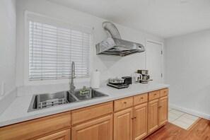 Fridge, microwave, stovetop, coffee/tea maker