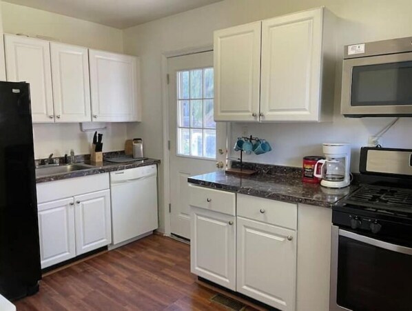 Fridge, microwave, cookware/dishes/utensils