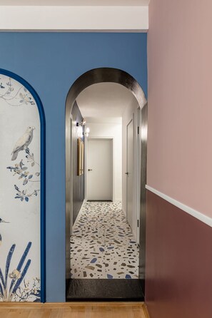 Stunning arched doorway leads to a beautifully appointed room.