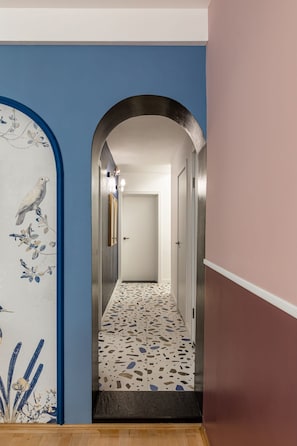 Stunning arched doorway leads to a beautifully appointed room.