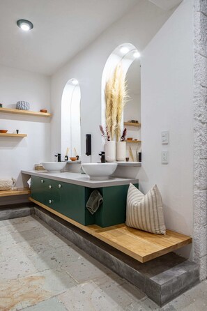 A modern bathroom with two sinks, a vanity, and a bench. - Sleeps 9 Outdoor Space Pingpong Table in Villa (Oaxaca)