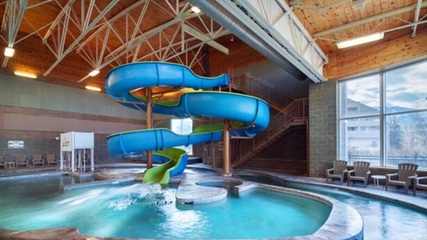 An indoor water park with multiple slides and a pool area. - Sheraton Mountain Vista Villas (2BR) (Avon)