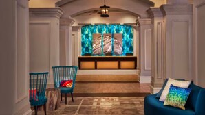 A hallway with a bench, two chairs, and a sofa. - OceanWatch (2 Bedroom) (Myrtle Beach)
