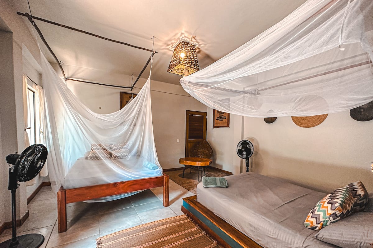 Family Room, 2 Double Beds | Individually decorated, individually furnished, free WiFi, bed sheets