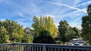 A residential street with trees and a clear sky. - 5 min to DWTN, BART & Park| Private Deck w/ View (Concord)