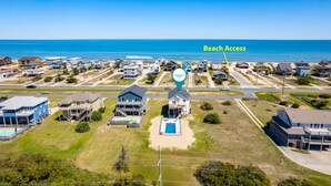 A coastal residential area with houses and a clear view of the beach. - Carolina Sol: Semi-Oceanfront, Private Pool, Close to beach and Outer Banks Fishing Pier (Nags Head)