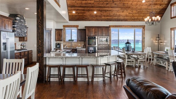 A spacious kitchen with a large island, wooden ceiling, and a view of the mountains. - Spectacular views of Bear Lake in a spacious private retreat on nearly 6 acres! (Fish Haven)