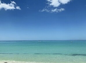 A clear blue sky over a calm sea with a distant boat and a buoy. - Beautiful family house in Venice, Fl. It is only a mile away from Shamrock Park  (Venice)