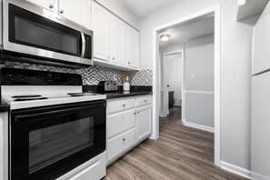 Coffee/tea maker, fridge, microwave, oven