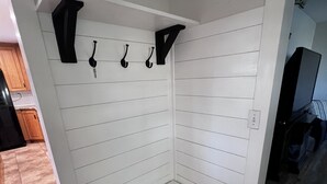 A corner bench with a white wall and a small shelf above it. - Split Mountain View Paradise! Life on the farm! (Vernal)