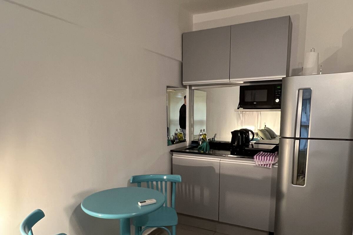 Espresso maker, full-sized fridge, microwave, stovetop