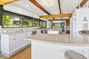 Enjoy cooking in this well-equipped kitchen with appliances and ample counter space.