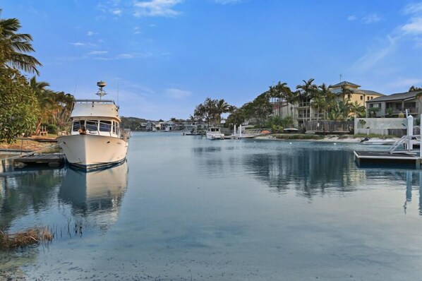 Enjoy a serene waterfront setting with a marina and residential views.