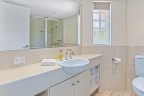 Combined shower/bathtub, hair dryer, towels, toilet paper