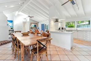 Enjoy meals around a large dining table surrounded by comfortable chairs in this well-appointed space.