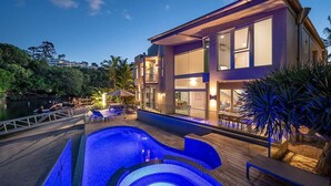 A modern two-story house with a swimming pool, large windows, and a deck area. - 31 Witta Circle, Noosa Heads (Noosa Heads)