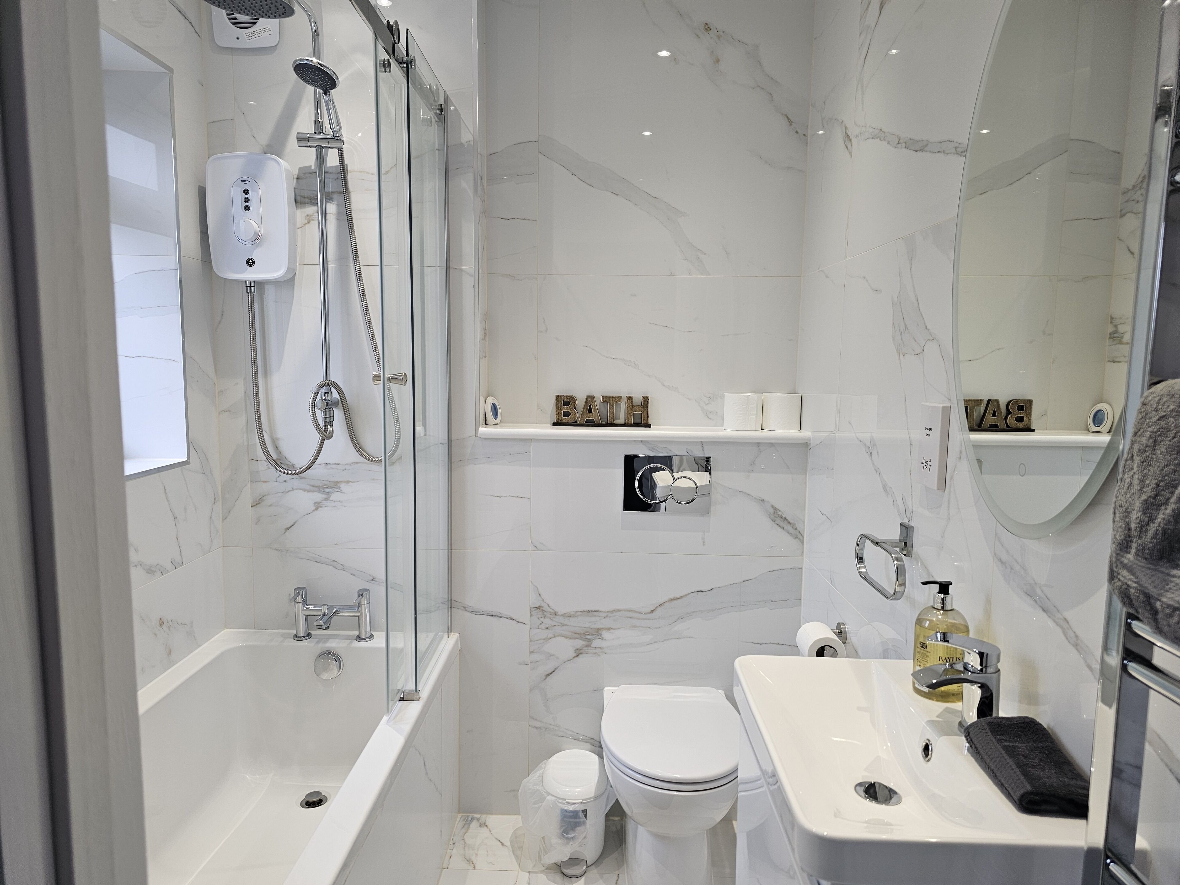 Shower, hair dryer, towels, soap