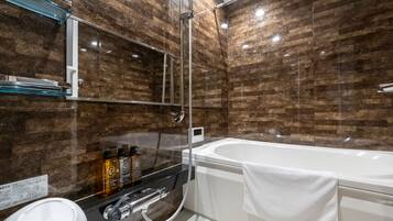 Separate bathtub and shower, free toiletries, hair dryer, slippers