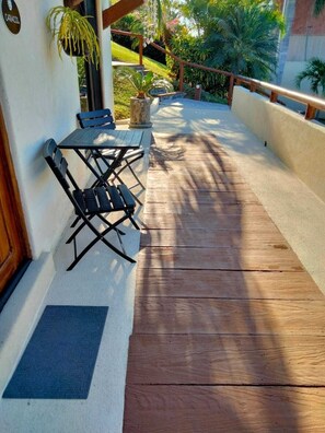 Relax on the outdoor patio with a seating area featuring a table and chairs.