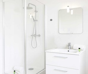 Shower, hair dryer, towels, soap