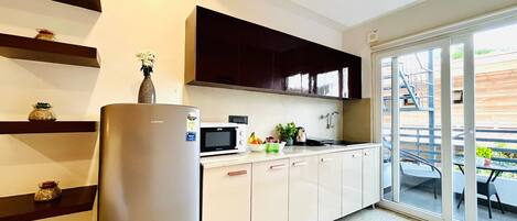 Fridge, microwave, cookware/dishes/utensils