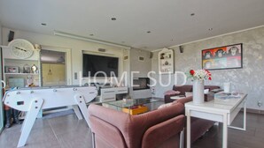 A modern living room with a pool table, comfortable seating, and a large TV. - Modern 4 bedroom villa with jacuzzi  et  private pool - 25 km from Cannes (SPERACEDES)